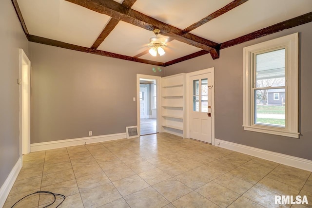 tiled foyer entrance featuring ceiling fan and beam ceiling