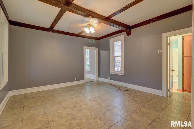 unfurnished room featuring ceiling fan, coffered ceiling, beamed ceiling, and light tile patterned floors