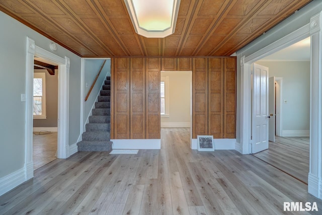 empty room featuring light wood-type flooring and plenty of natural light