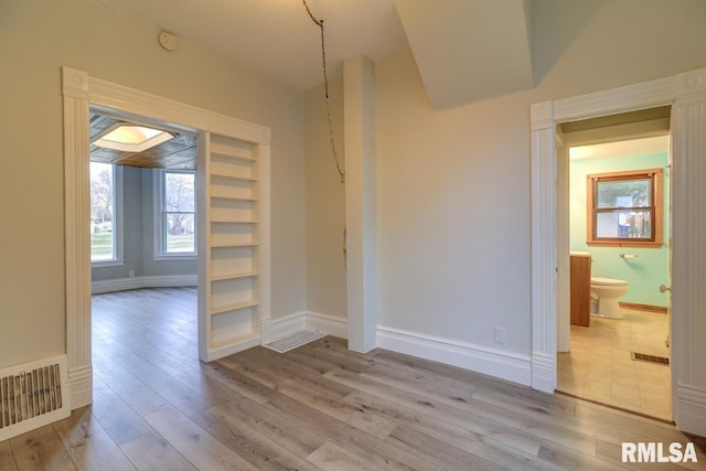 unfurnished room featuring light wood-type flooring