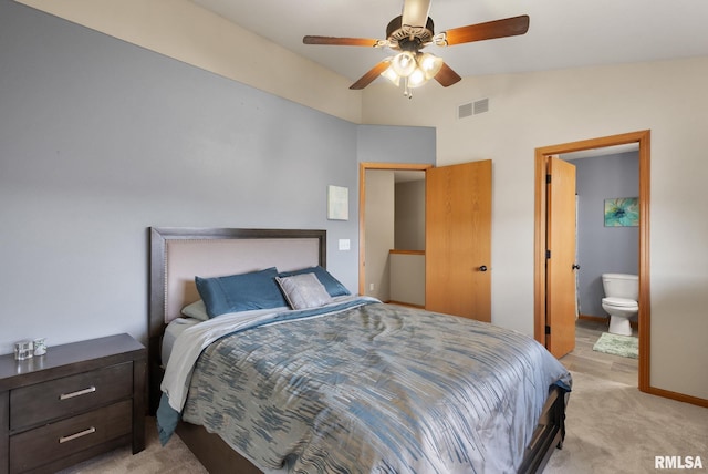 bedroom with light carpet, connected bathroom, ceiling fan, and lofted ceiling