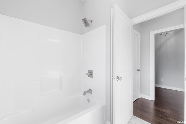 bathroom featuring shower / bathtub combination and wood-type flooring