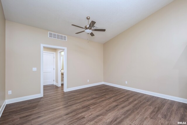 125 Beacon Harbor Cir, East Moline, IL 61244 - spare room with dark wood finished floors, baseboards, visible vents, and ceiling fan