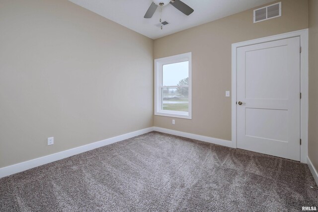 125 Beacon Harbor Cir, East Moline, IL 61244 - spare room featuring baseboards, carpet floors, ceiling fan, and visible vents