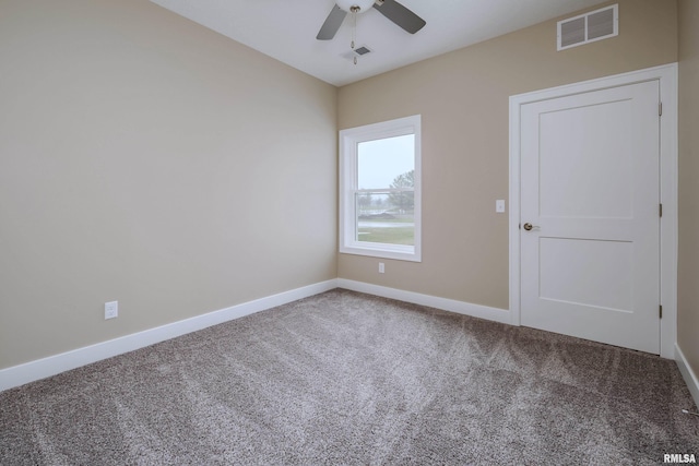 carpeted empty room featuring ceiling fan