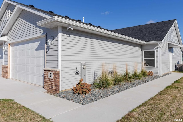 view of side of home featuring a garage