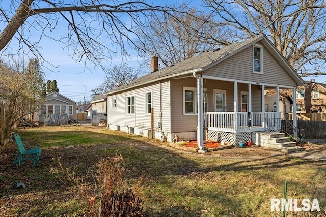 bungalow-style house featuring a porch and a front yard