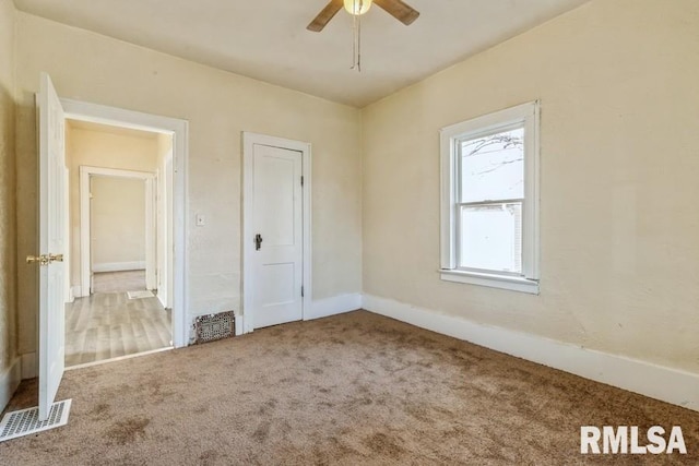 unfurnished bedroom with carpet flooring and ceiling fan