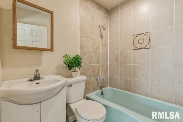 full bathroom featuring vanity, toilet, and tiled shower / bath combo