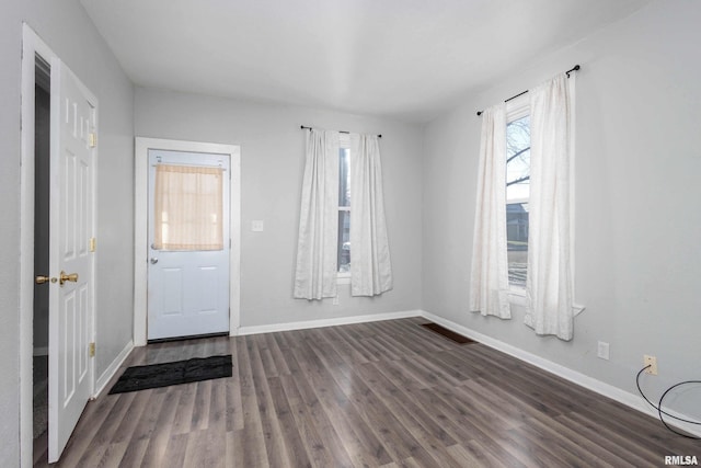 foyer entrance featuring dark hardwood / wood-style floors