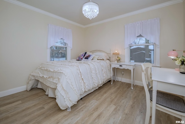 bedroom featuring an inviting chandelier, ornamental molding, and light wood-type flooring