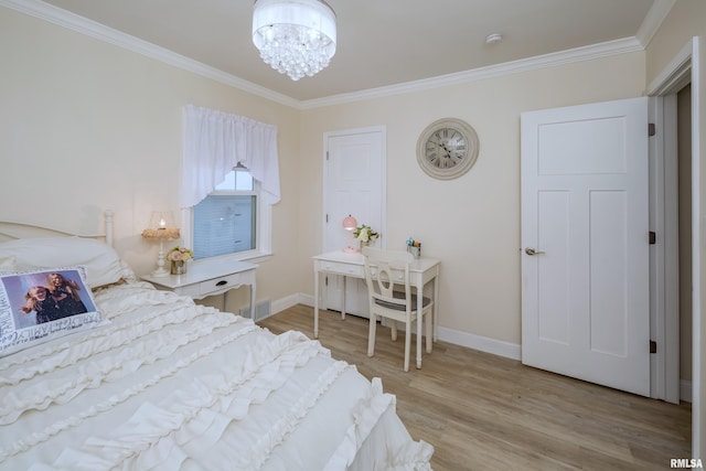 bedroom with light hardwood / wood-style flooring, a notable chandelier, and ornamental molding