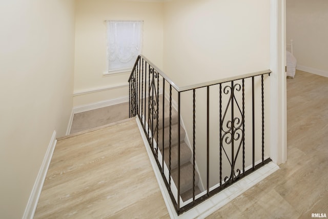 stairway featuring hardwood / wood-style floors