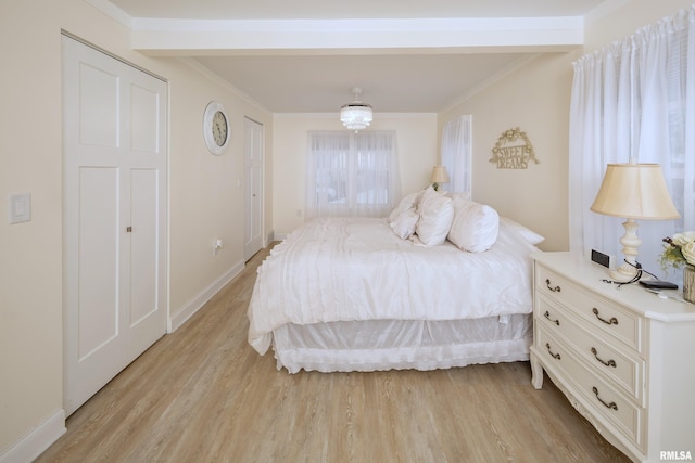 bedroom with light hardwood / wood-style flooring and ornamental molding