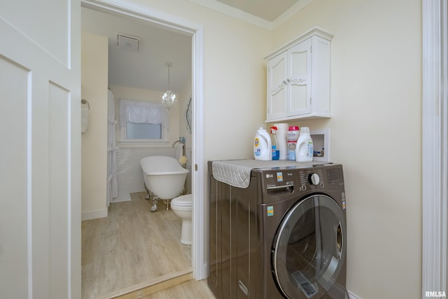 washroom with a notable chandelier, washer / dryer, light wood-type flooring, and crown molding