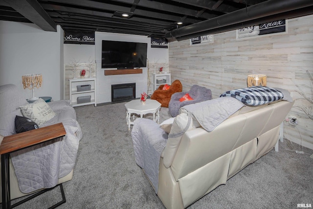 carpeted living room with beam ceiling