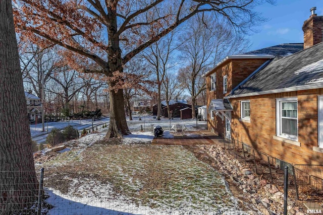 view of yard covered in snow