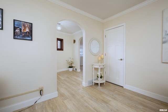 corridor featuring light hardwood / wood-style floors and ornamental molding