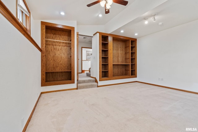 unfurnished bedroom with carpet floors and lofted ceiling