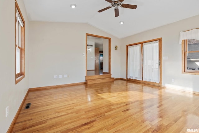 unfurnished room featuring vaulted ceiling, light hardwood / wood-style flooring, and ceiling fan