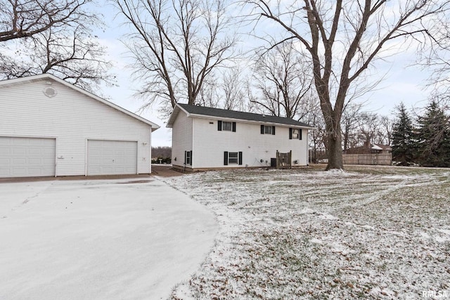 view of snow covered back of property