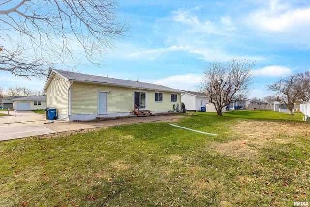 back of property featuring a lawn