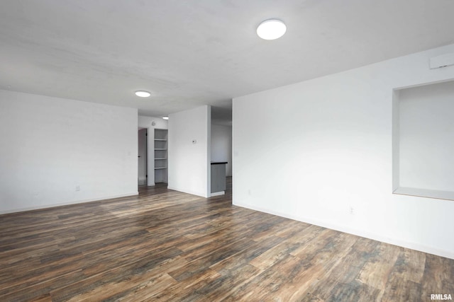 spare room featuring dark hardwood / wood-style flooring