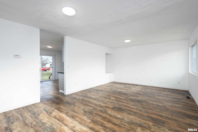 unfurnished room with dark hardwood / wood-style floors