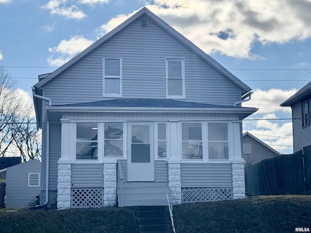 view of side of property with a sunroom