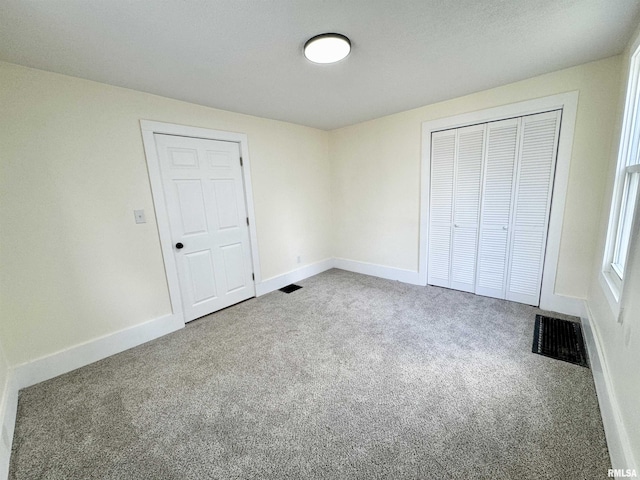 unfurnished bedroom with carpet flooring