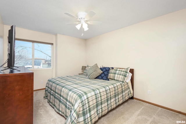 bedroom featuring ceiling fan and light colored carpet