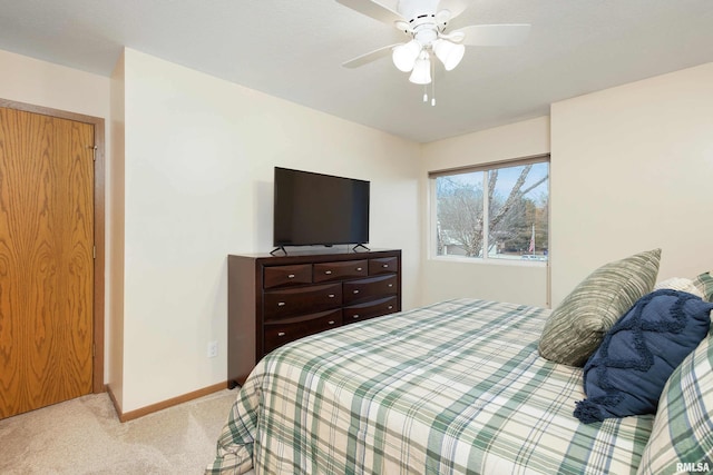 bedroom with ceiling fan and light colored carpet