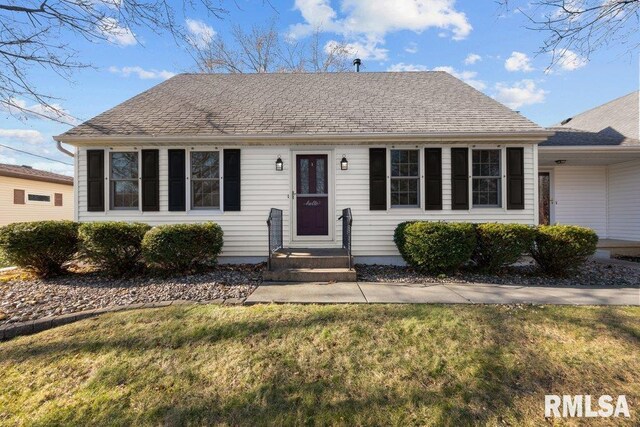 ranch-style house with a front yard