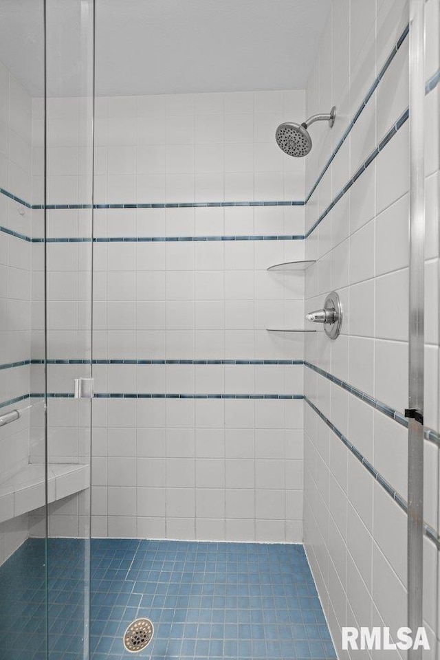 bathroom with tiled shower