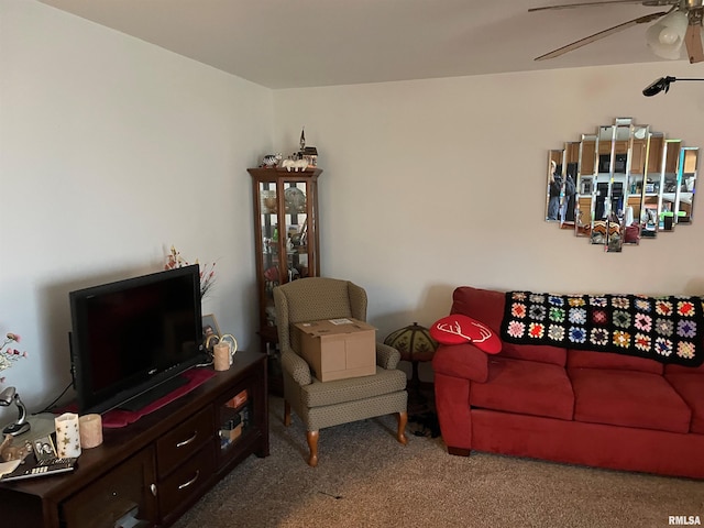 carpeted living room featuring ceiling fan