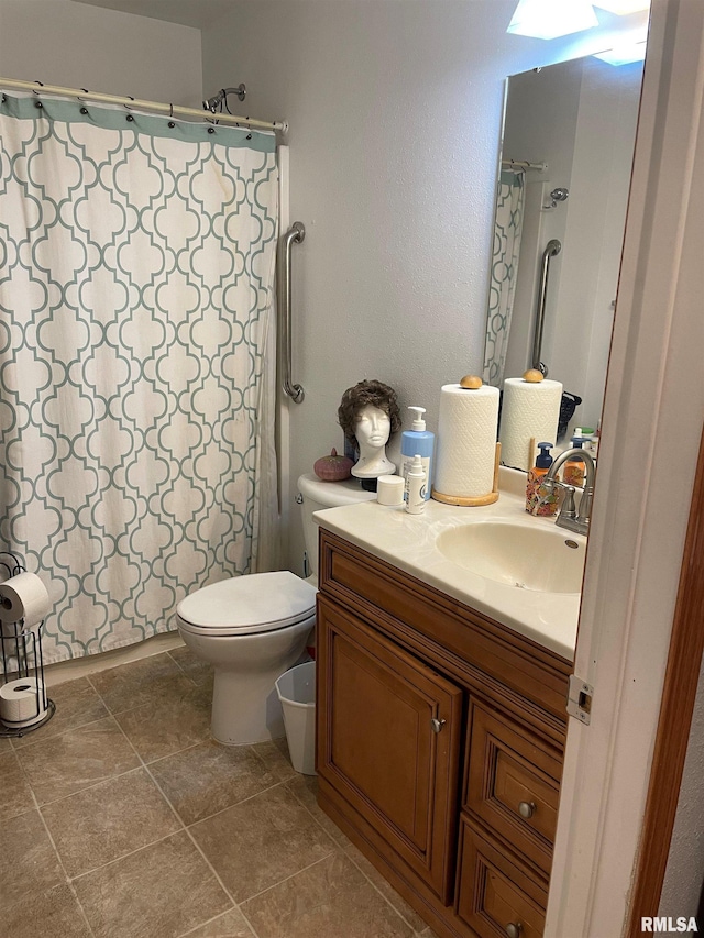 bathroom with toilet, curtained shower, and vanity