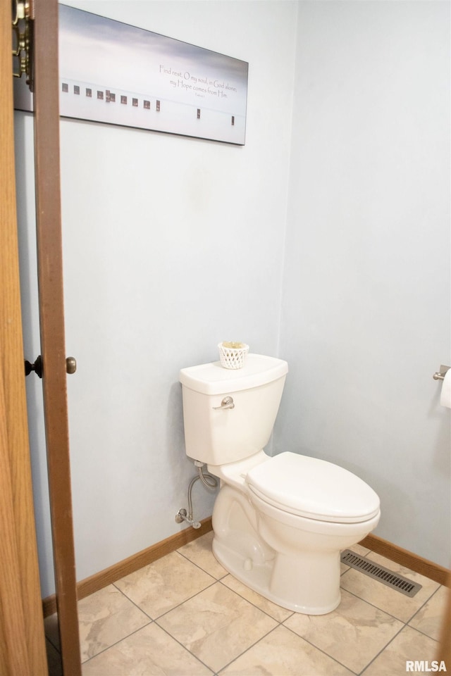 bathroom featuring tile patterned floors and toilet