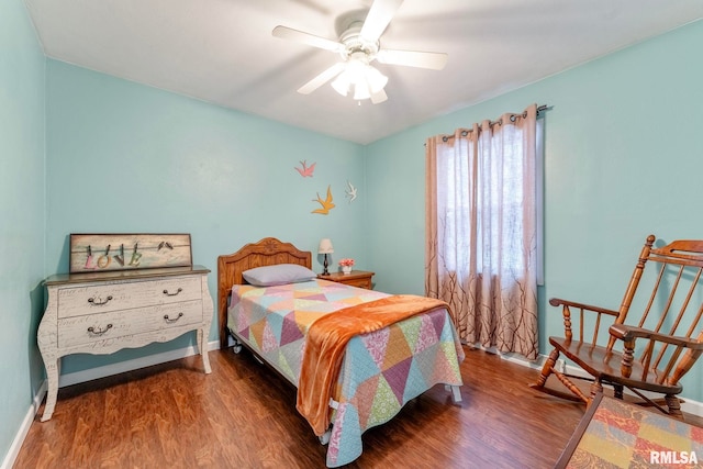 bedroom featuring ceiling fan and dark wood-type flooring