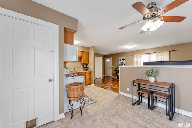 kitchen with ceiling fan and sink