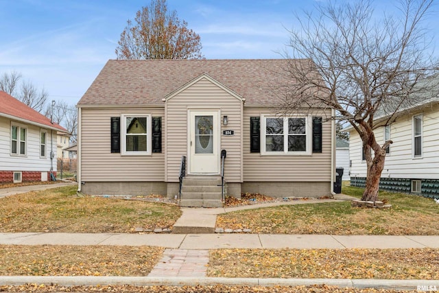 bungalow with entry steps and roof with shingles