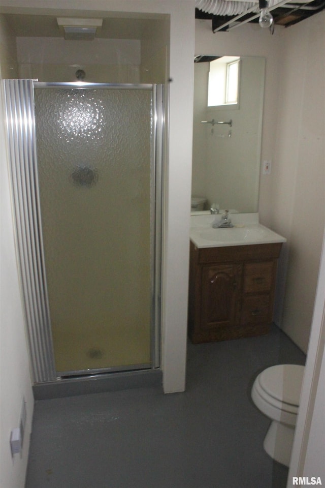 bathroom featuring vanity, ceiling fan, toilet, and a shower with shower door