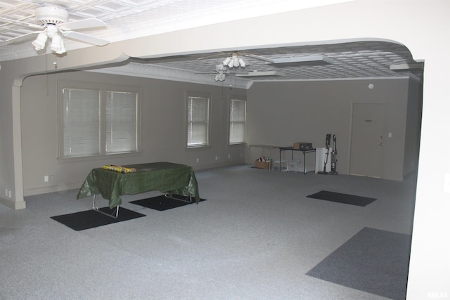 carpeted living room featuring ceiling fan and pool table