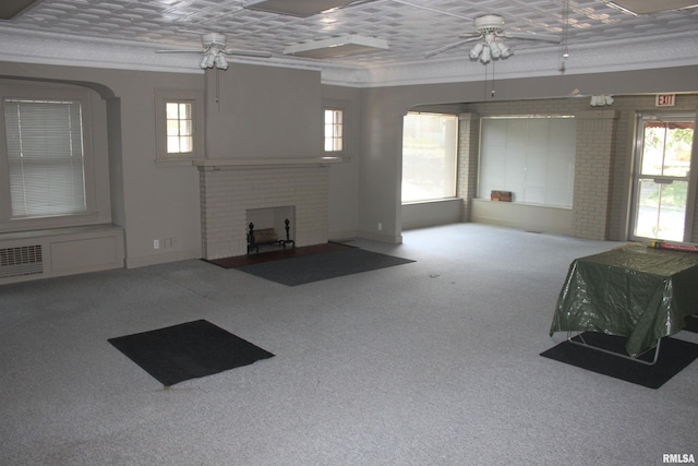 carpeted living room featuring ceiling fan and a brick fireplace