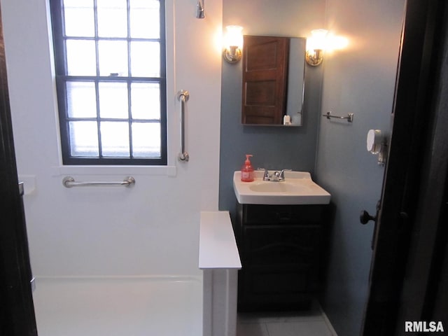 bathroom featuring tile patterned floors and vanity