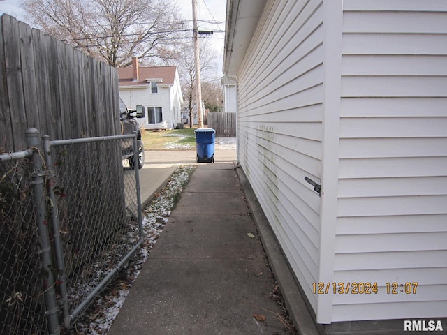 view of home's exterior with fence