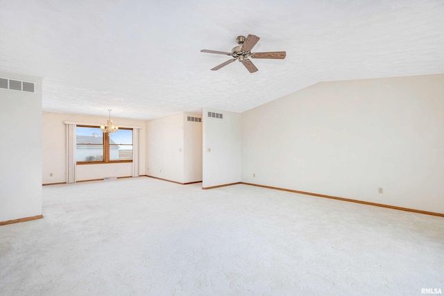 unfurnished room with a textured ceiling, lofted ceiling, light colored carpet, and ceiling fan with notable chandelier