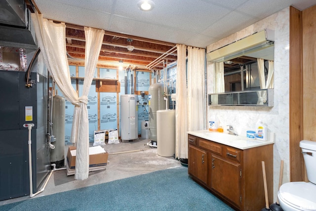 basement with water heater and sink