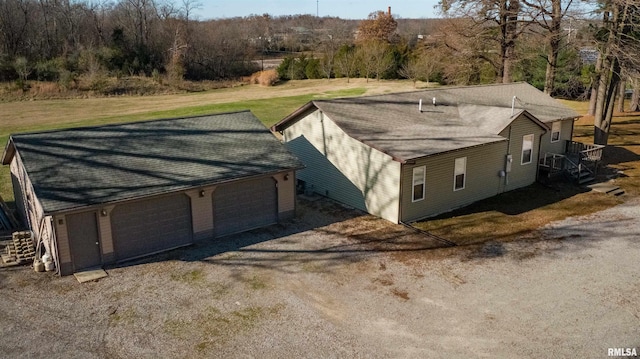 exterior space featuring a lawn and a garage