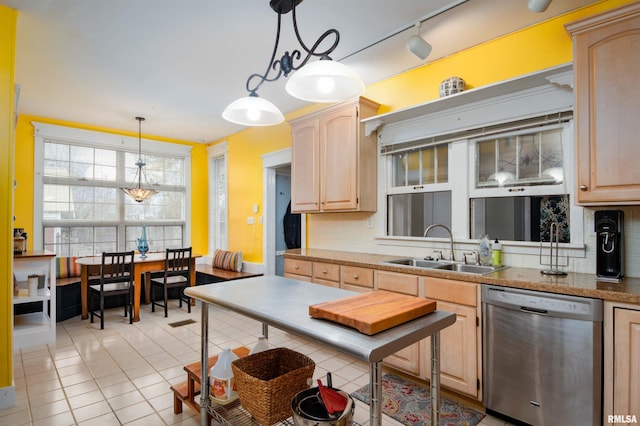 kitchen with dishwasher, decorative light fixtures, and light brown cabinetry