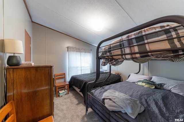 bedroom featuring a textured ceiling, light colored carpet, and vaulted ceiling